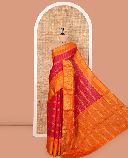 Rani Moss Chiffon Saree, Prettified with Horizontal Stripes, Peacock, and Floral Buttas All Over Its Body, Complemented by a Contrast Traditional Zari Border, Pallu Mirrors the Same Design, and Paired with a Contrast Floral-Paisley Blouse