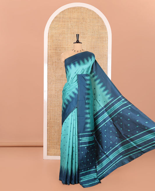 Rama Kanchi Silk Saree, Subtly Woven with Flower Buttas All Over Its Body, Complemented by a Contrast Temple Border, Pallu Mirrors the Same Floral Motifs, and Paired with a Contrast Blouse