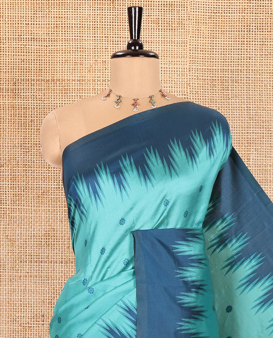 Rama Kanchi Silk Saree, Subtly Woven with Flower Buttas All Over Its Body, Complemented by a Contrast Temple Border, Pallu Mirrors the Same Floral Motifs, and Paired with a Contrast Blouse