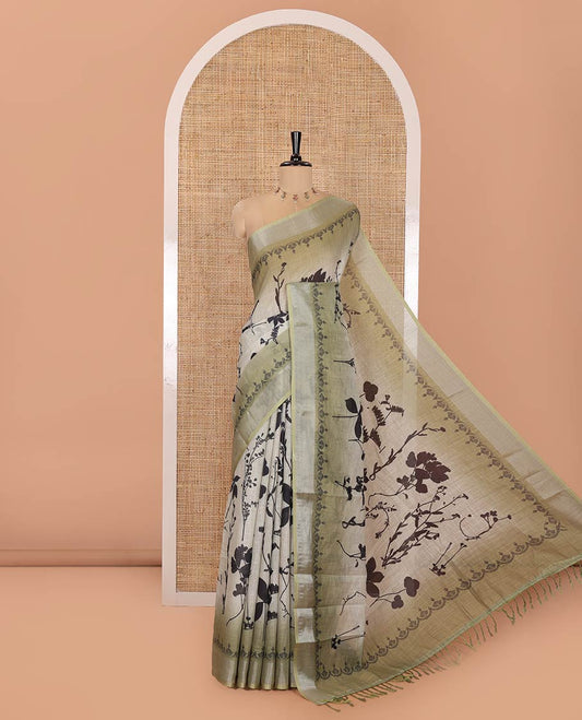 Green Linen Cotton Saree, Embellished with Silhouette-Style Floral Motifs Printed on Its Body, Subtle Zari Bavanji Border, Pallu of Silhouette-Style Floral Print, and Comes with a Matching Blouse