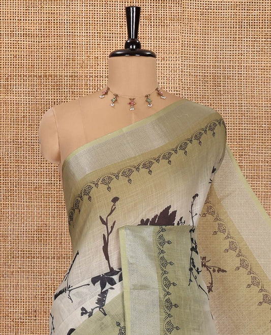 Green Linen Cotton Saree, Embellished with Silhouette-Style Floral Motifs Printed on Its Body, Subtle Zari Bavanji Border, Pallu of Silhouette-Style Floral Print, and Comes with a Matching Blouse