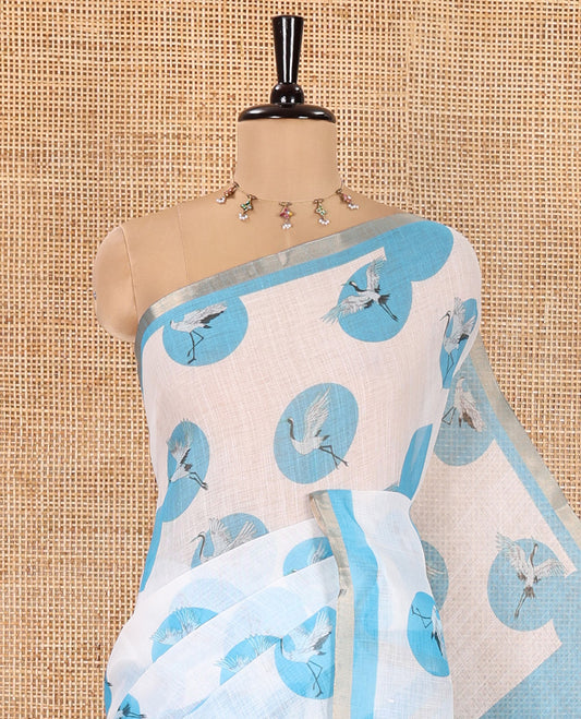White-Blue Linen Cotton Saree, Steeped with Polka Dot Enclosed Crane Motifs on Its Body, Subtle Piping Border, Pallu Pictures Polka Dot Enclosed Crane Motifs, and Paired with a Matching Blouse