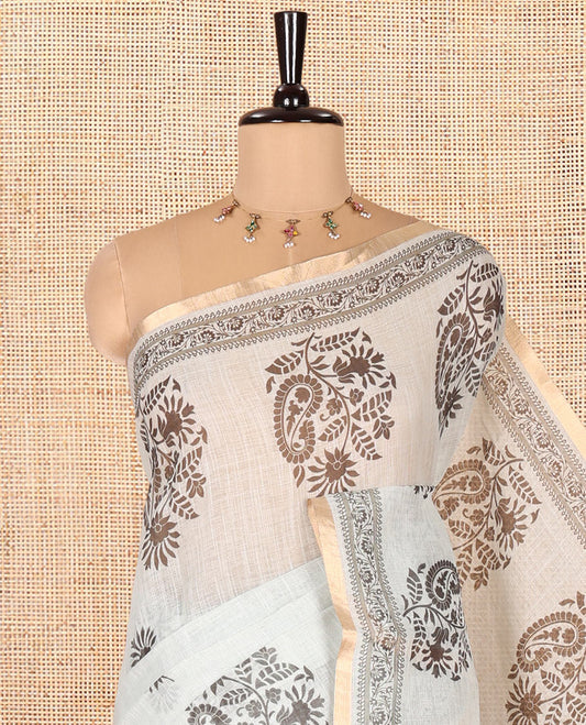 Pista Linen Cotton Saree, Bedecked with Floral-Paisley Motifs Print All Over Its Body, Highlighted by Gold Zari Printed Border, Floral-Paisley Printed Pallu and Paired with a Matching Blouse