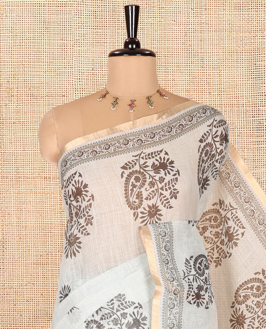 Pista Linen Cotton Saree, Bedecked with Floral-Paisley Motifs Print All Over Its Body, Highlighted by Gold Zari Printed Border, Floral-Paisley Printed Pallu and Paired with a Matching Blouse