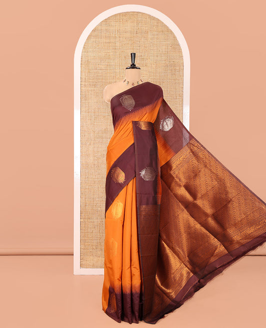 Rust Orange Kanchi Soft Silk Saree, Elevated with Paisley Buttas All Over Its Body,  Complemented by a Contrast Paisley Motifs Border, an Intricately Designed Pallu, and Paired with a Contrast Blouse