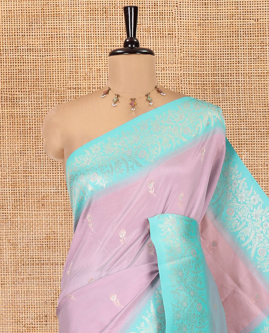 Dusky Pink-Lavender Elite Soft Silk Saree, Adorned with Zari Buttas, Complemented by Contrast Traditional Zari Border, Intricate Pallu and a Contrast Blouse