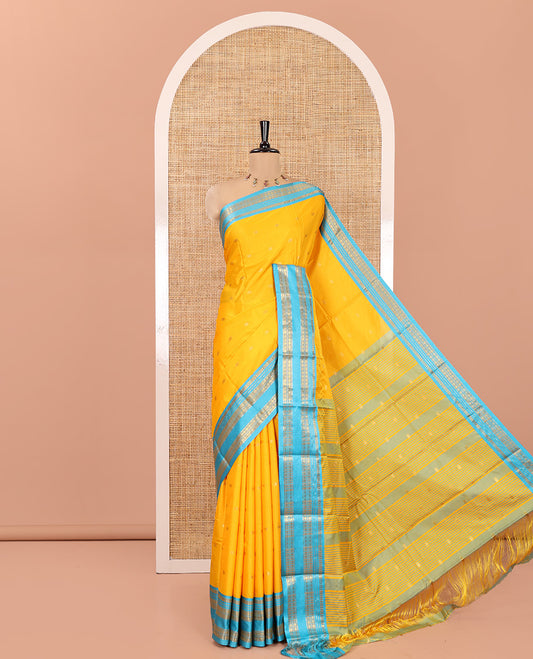 Yellow Softy Silk Saree, Bedecked with Zari Buttas, Contrast Traditional Rettai Pettu Border, and a Contrast Blouse