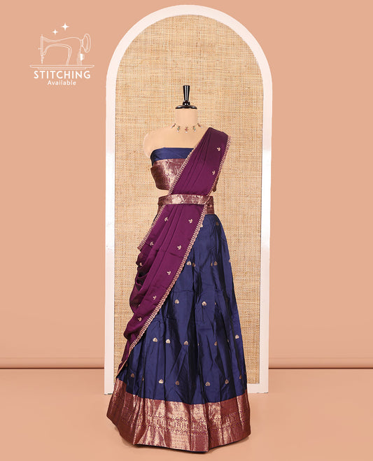 Dark Blue and Purple Semi-Banarasi Half-Saree, Prettified with Zari Buttas on Its Skirt, Complemented by a Contrast Traditional Zari Design Woven Border, Paired with a Matching Blouse, and a Contrast Satin Georgette Embroidered Scallop Dhavani