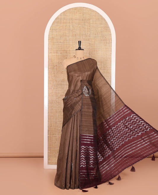 Borderless chikku floral buttas matka silk saree, contrast striped and buttas pallu, and a zari buttas woven blouse