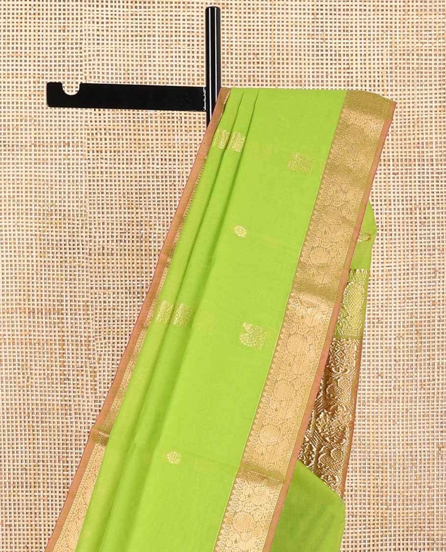 Light green motifs silk cotton saree with intricate zari design border & floral design pallu