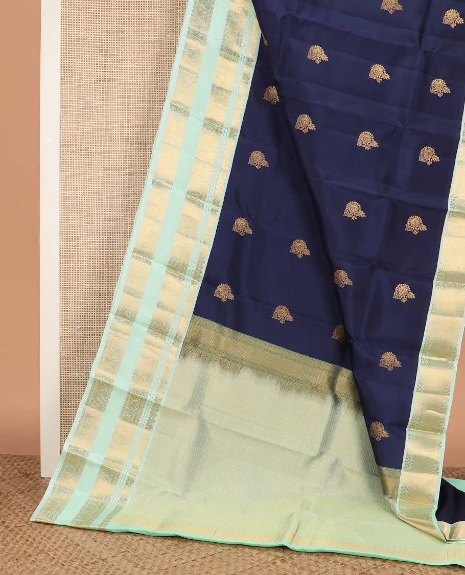 Blue zari buttas Vasundhara silk mix saree, contrast rettai pettu border of thilakam, muthu, neli, and mayil designs, and intricate pallu