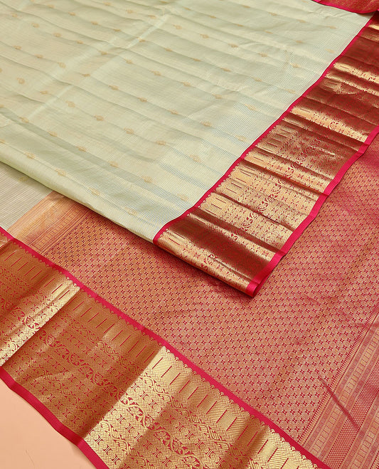 Pale Green Vasundhara Lite Silk Mix Saree, Enriched with Zari Buttas and Stripes on Its Body, Complemented by a Contrast Border of Kathir, Kodi Manga, and Rudraksham Mayil Designs, Majestically Detailed Pallu, and Paired with a Contrast Blouse