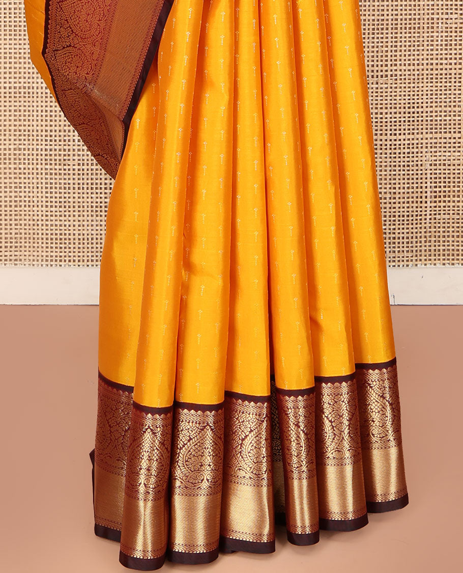 Orange Vasundhara Silk Saree, Adorned with Zari Buttas on Its Body, Complemented by a Contrast Border of Thilakam, Muthu, Kathir, and Jaga Nagam Designs, Grand Jaal Pallu, and Paired with a Contrast Blouse