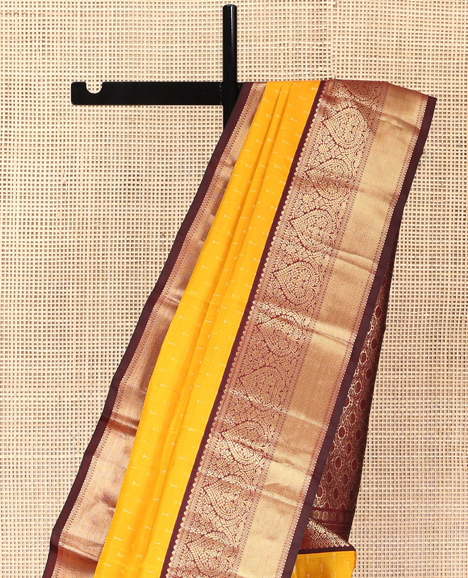 Orange Vasundhara Silk Saree, Adorned with Zari Buttas on Its Body, Complemented by a Contrast Border of Thilakam, Muthu, Kathir, and Jaga Nagam Designs, Grand Jaal Pallu, and Paired with a Contrast Blouse