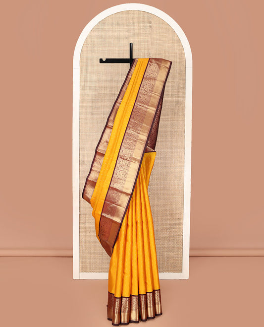 Orange Vasundhara Silk Saree, Adorned with Zari Buttas on Its Body, Complemented by a Contrast Border of Thilakam, Muthu, Kathir, and Jaga Nagam Designs, Grand Jaal Pallu, and Paired with a Contrast Blouse