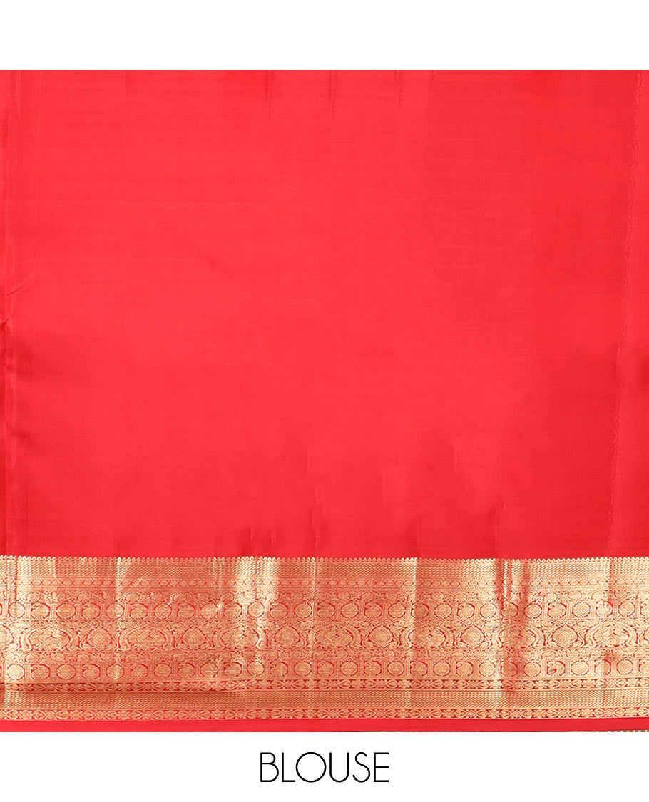 Green Kanchipuram Silk Saree Delicately Woven with Manga Jacquard Design, Complemented by Contrast Border of Thilakam, Chakram, Manga, Kodi Visiry,  Mayil, and Jada Nagam Designs, Pallu Gleamed Up with Jaal Designs, and Paired with a Contrast Blouse