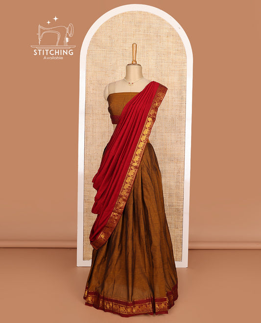 Mustard cotton half-saree, plain with contrast elephant motif bordered skirt, matching blouse, and contrast elephant motif bordered dhavani