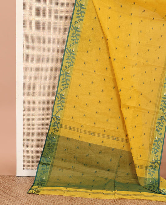 Yellow Bengal Cotton Saree, Woven with Buttas on Its Body, Highlighted by a Jamdani-Style Floral Creeper Border, and Pallu Steeped with Buttas