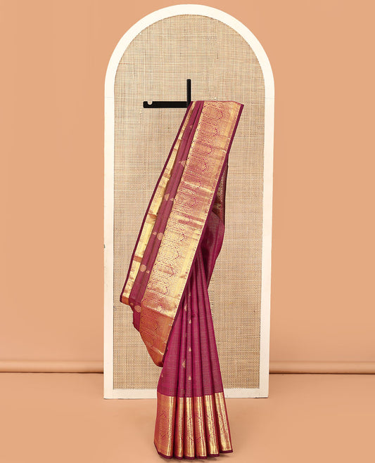 Purple zari stripes and buttas Kanchipuram silk saree,  zari border of thilakam, poun, and MUghal-style floral designs, and pallu steeped with manga motifs