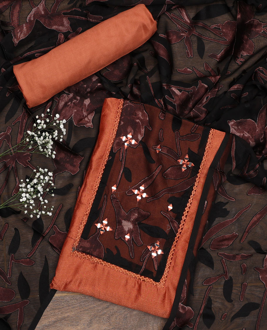 Orange material chudidar set, patch embroidered top, plain bottom, and contrast floral printed dupatta