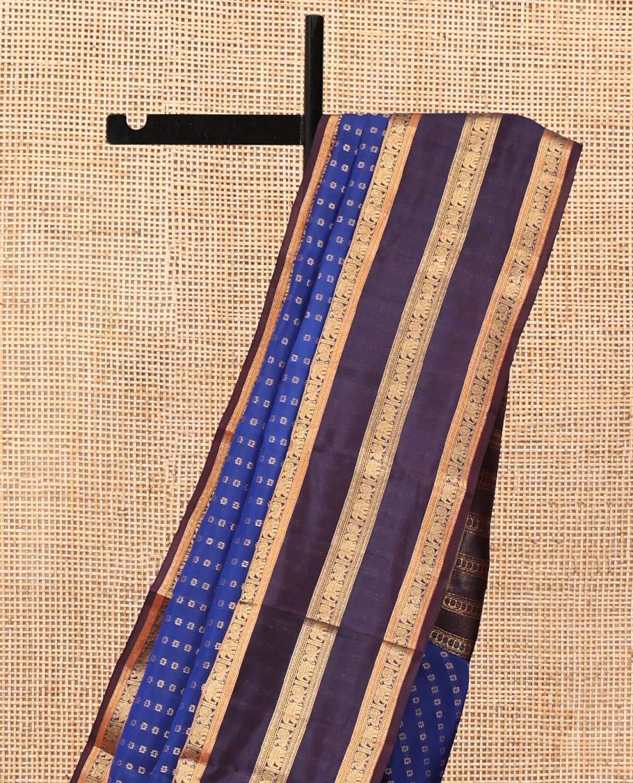 Blue Vasundhara Lite Silk Mix Saree, Richly Detailed with Zari Buttas All Over Its Body, Complemented by Contrast Varisai Pettu Border of Mayil and Yaanai Designs, Grandly Decked Up Pallu and Paired with a Contrast Blouse