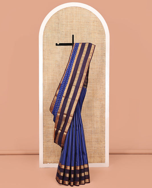 Blue Vasundhara Lite Silk Mix Saree, Richly Detailed with Zari Buttas All Over Its Body, Complemented by Contrast Varisai Pettu Border of Mayil and Yaanai Designs, Grandly Decked Up Pallu and Paired with a Contrast Blouse