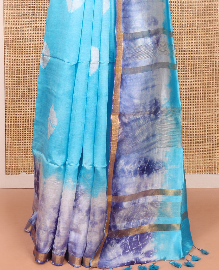 Blue Banana Pith Saree Beautified with Shibori Prints, Subtly Made Zari Bavanji Border, Pallu Featuring Zari Stripes and Shibori Print, and Paired with a Matching Shibori Printed Blouse