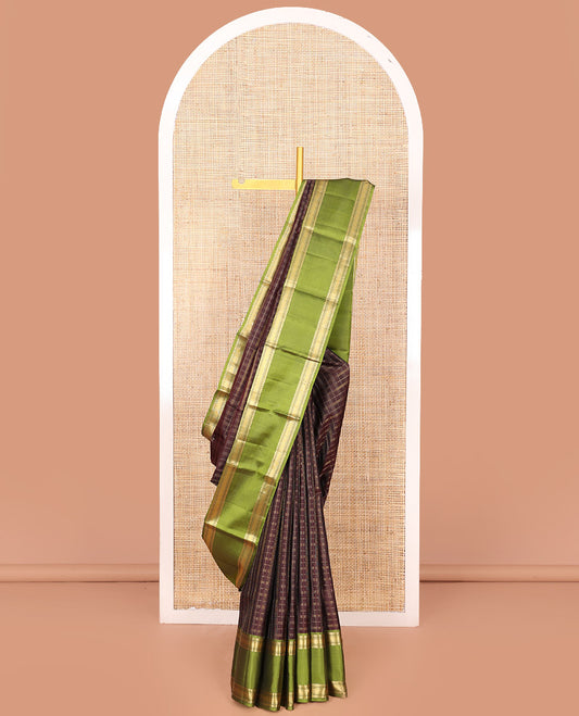 Brown Vasundhara Silk Saree Adorned with Zari Checks, Highlighted by a Contrast Rettai Pettu Border of Rekku, Muthu, Banaras, and Mayil Kann Designs, a Zari-Woven Pallu of Kathir Designs, and Paired with a Contrast Blouse