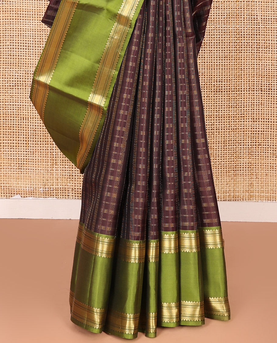 Brown Vasundhara Silk Saree Adorned with Zari Checks, Highlighted by a Contrast Rettai Pettu Border of Rekku, Muthu, Banaras, and Mayil Kann Designs, a Zari-Woven Pallu of Kathir Designs, and Paired with a Contrast Blouse