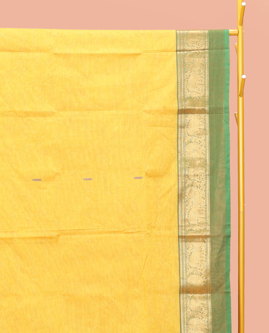 Yellow Chettinad Cotton Saree, Finely Crafted with Thread Buttas All Over Its Body, Complemented by a Contrast Ganga-Jamuna Kal Eragina Border of Kodi Peacock and Elephant Designs, Pallu of Buttas and Stripes, and Paired with a Matching Blouse