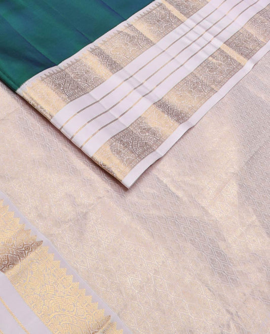 Green floral butta silk saree, contrast border of rekku,rudraksham,floral,banaras & mayil, & ogee patterned pallu