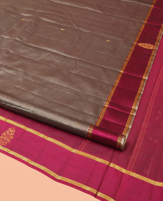 Grey Kanchipuram Silk Saree Enriched with Zari Buttas, Complemented by a Contrast Border of Zari Designs, Zari Pallu of Zari Buttas, and Paired with a Contrast Blouse