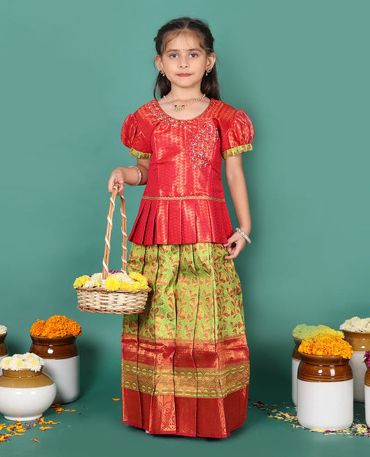 Green readymade art silk pavadai set, floral jacquard with contrast traditional zari border skirt, and contrast jacquard embroidered puff-sleeve blouse