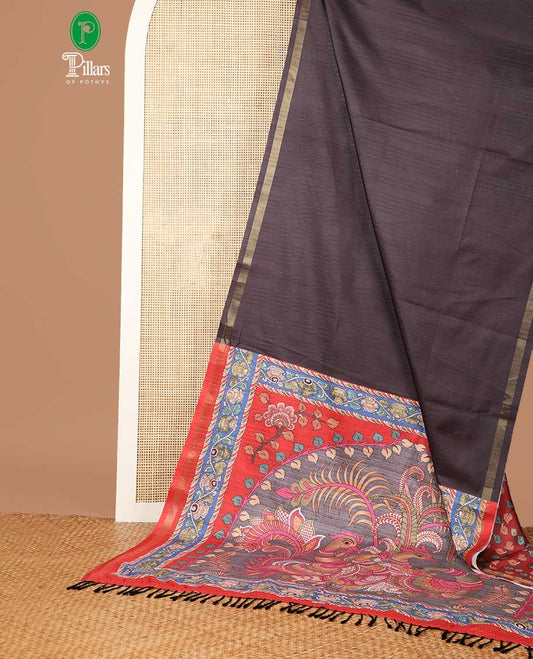 Black semi kicha tussar saree with small zari border & kalamkari pallu along with floral printed blouse