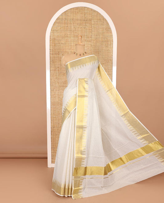 Cream golden zari checked woven Kerala cotton saree, zari temple bavanji border, striped pallu, and a matching blouse