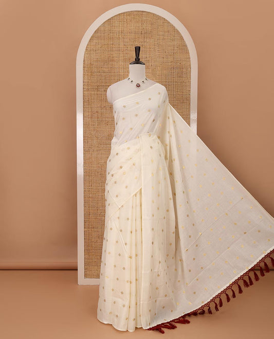Borderless Kerala cream all over zari buttas saree, zari design pallu with maroon tussels & zari buttas blouse