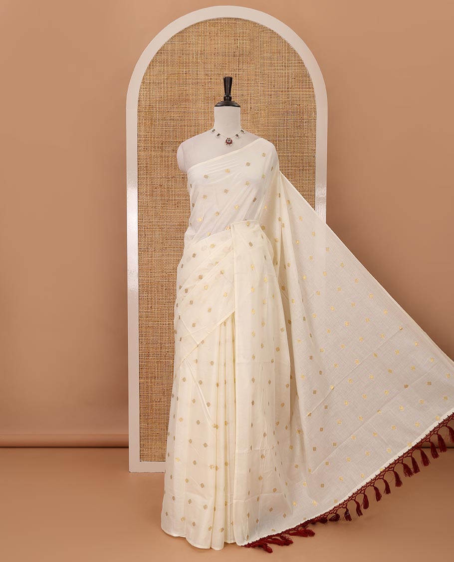 Borderless Kerala cream all over zari buttas saree, zari design pallu with maroon tussels & zari buttas blouse