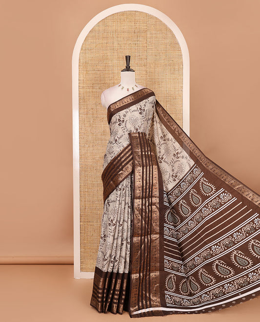 Brown floral printed dola silk saree,  contrast traditional zari rettai pettu border, pallu of paisley-floral print & contrast blouse of print & zari border