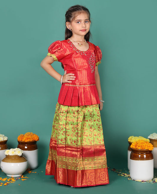 Green readymade art silk pavadai set, floral jacquard with contrast traditional zari border skirt, and contrast jacquard embroidered puff-sleeve blouse