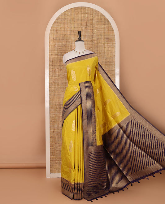 Mustard floral zari buttas dola silk saree, contrast traditional zari peacock border, diagonal floral zari striped pallu & contrast jacquard blouse