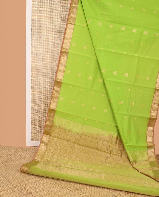 Light green motifs silk cotton saree with intricate zari design border & floral design pallu