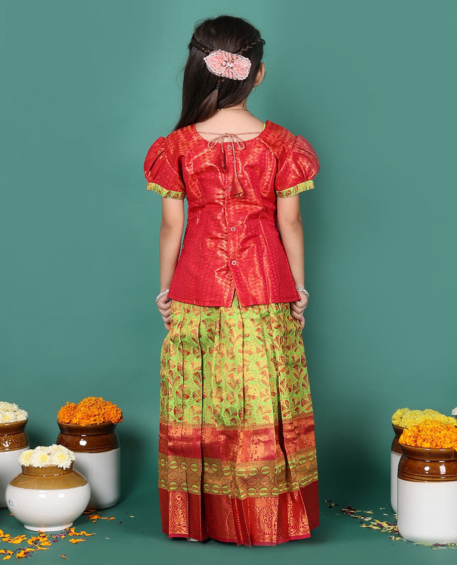 Green readymade art silk pavadai set, floral jacquard with contrast traditional zari border skirt, and contrast jacquard embroidered puff-sleeve blouse