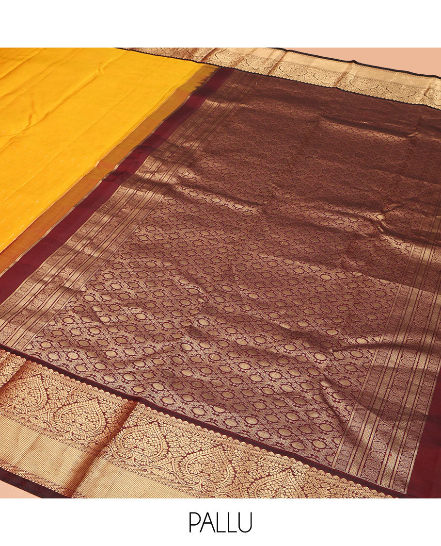 Orange Vasundhara Silk Saree, Adorned with Zari Buttas on Its Body, Complemented by a Contrast Border of Thilakam, Muthu, Kathir, and Jaga Nagam Designs, Grand Jaal Pallu, and Paired with a Contrast Blouse