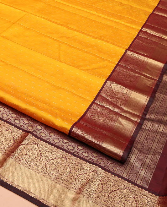 Orange Vasundhara Silk Saree, Adorned with Zari Buttas on Its Body, Complemented by a Contrast Border of Thilakam, Muthu, Kathir, and Jaga Nagam Designs, Grand Jaal Pallu, and Paired with a Contrast Blouse