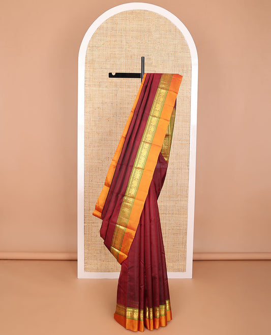Maroon kancheepuram silk saree with contrast border of thilakam mokku, banaras, mayil, yanaai design & striped pallu