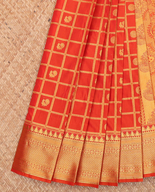 Red Budget Silk Saree, Artfully Detailed with Peacock-Chakram Butta Enclosed Checks All Over Its Body, Highlighted by a Temple Zari Border of Traditional Designs, Pallu Depicts Mughal-Style Intricate Designs, and Paired with a Matching Blouse