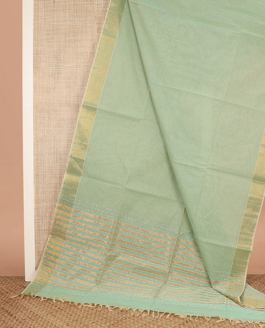 Green sparsely striped jute cotton saree, zari bavanji border, and striped pallu