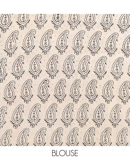 Blue floral vine and bird machine-printed Kalamkari cotton saree, contrast Pichwai cow border, and pallu of floral-peacock designs