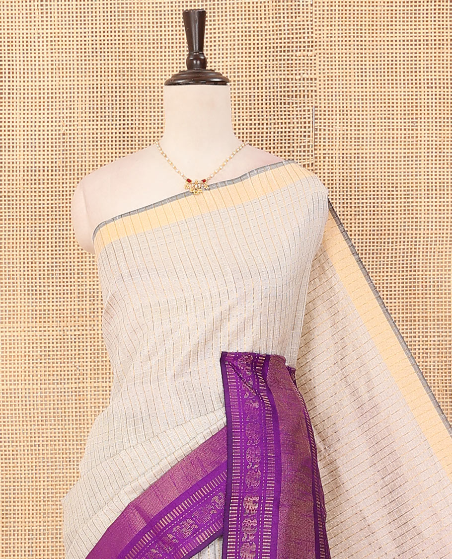 Light sandal butta enclosed checked dupion saree, contrast traditional zari border, and zari design pallu