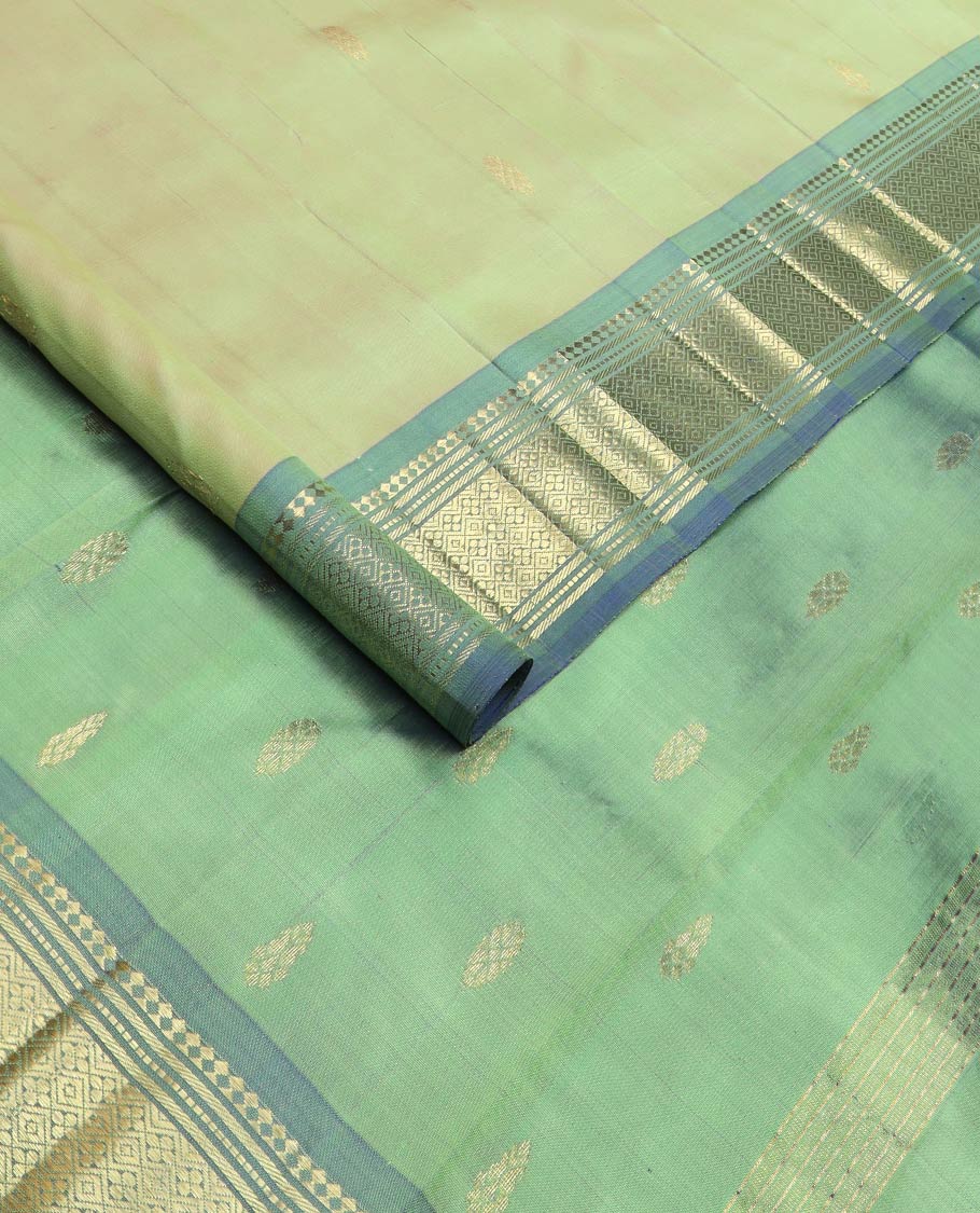 Green zari buttas kanchipuram silk saree, contrast one-sided korvai border of panner sombu,banaras,muthu & jaal & zari design pallu